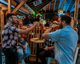 People enjoying drinks at The Oar