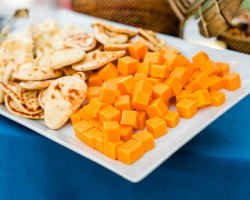 small pieces of nann and cheddar cheese