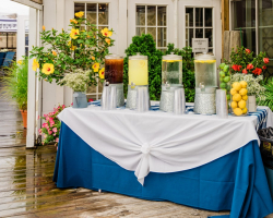 photo of event decor outside drinks and flowers